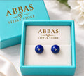 Natural lapis lazuli beads, Silver-tone metal accents, Classic minimalist design.